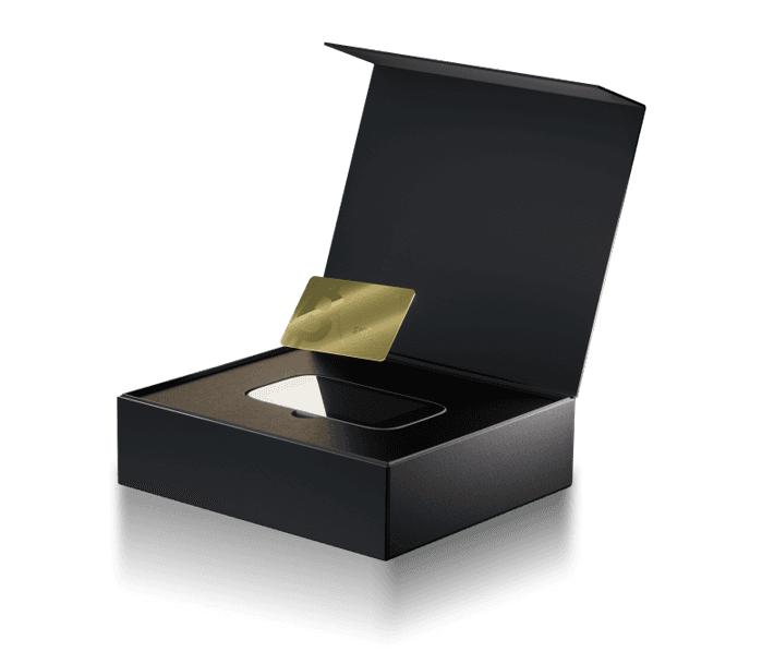 Open black gift box holding a gold Bitcoin card and an NGRAVE ZERO